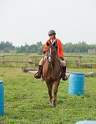 Cinette and Blaze Going Throgh the Barrels at Horse Country Camp