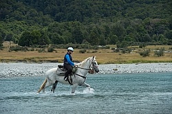Heather and Cloud on A River Crossing on the Day Ride From Boundary Hut, Wild Womens Expeditions with Adventure Horse Trekking New Zealand