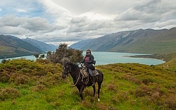 Shawn on Hannah on The Ride Out Of Dingleburn Station on the Land of the Long White Cloud Ride with Wild Womens Expeditions and Adventure Horse Trekking New Zealand