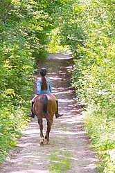 Young Girl Trail Riding Bareback