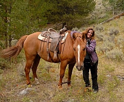 Shawn with her Horse Hobbled at Blue Sky Sage Horse Adventures
