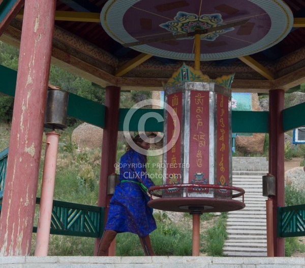 Shawn turning the wheel at the Buddhist Monastery