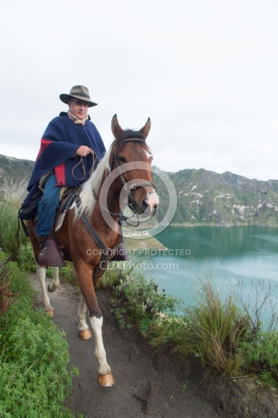 Gabriel riding around  Crater Lake at Quilotoa volcano