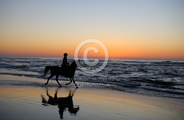 Riding on the beach at Sunset at Ricochet Ridge Ranch